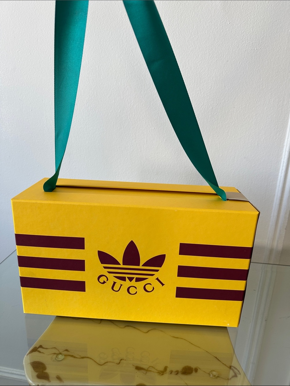 Gucci Yellow Box with Burgundy Logo and Teal Ribbon